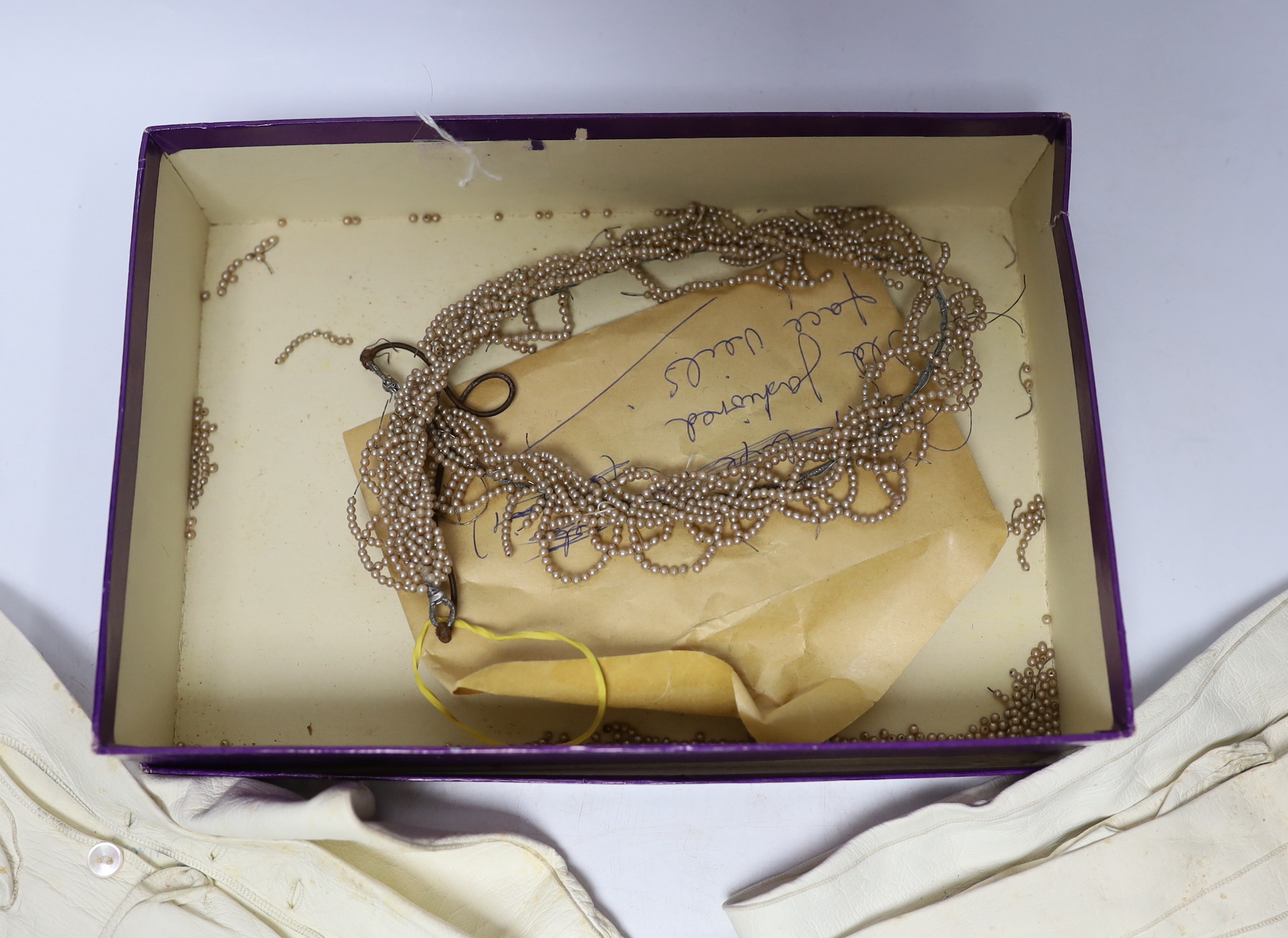 Cream leather evening gloves, bonnet veiling and decorative bridal headdress